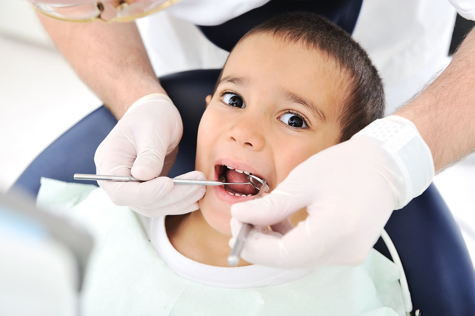 young boy in dentists chair