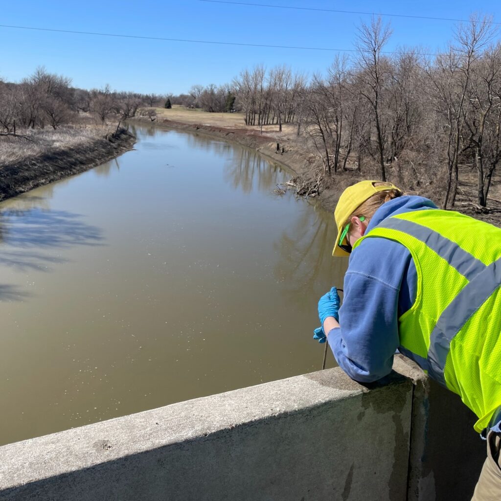Volunteer working to clean river