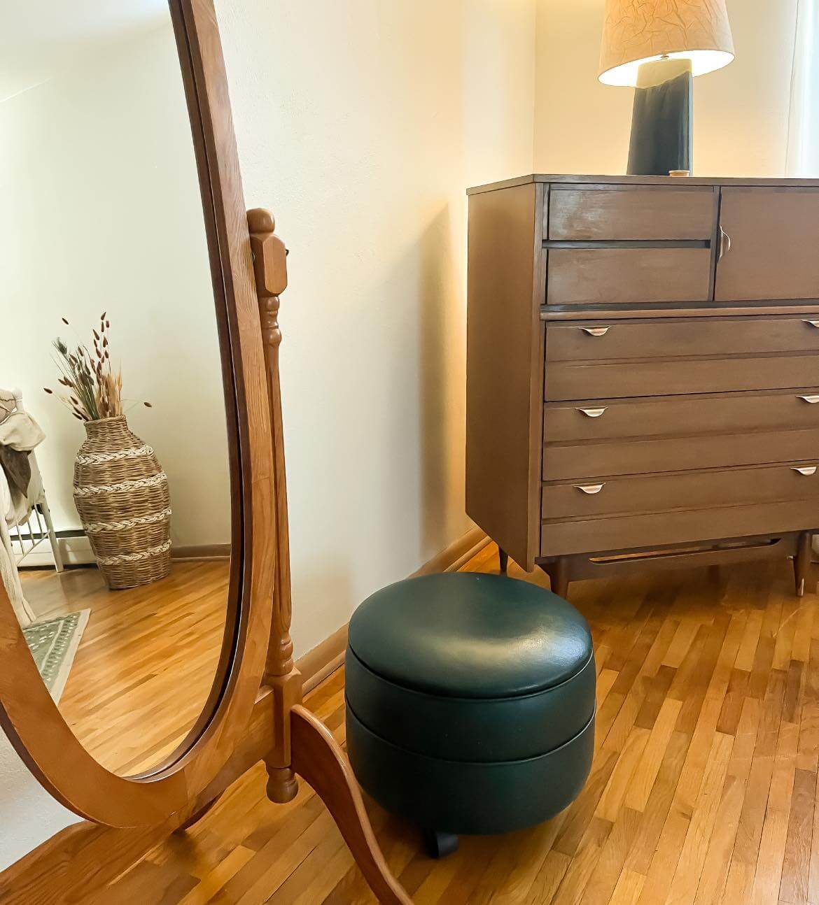 Mirror and dresser in a bedroom at Barbara House.