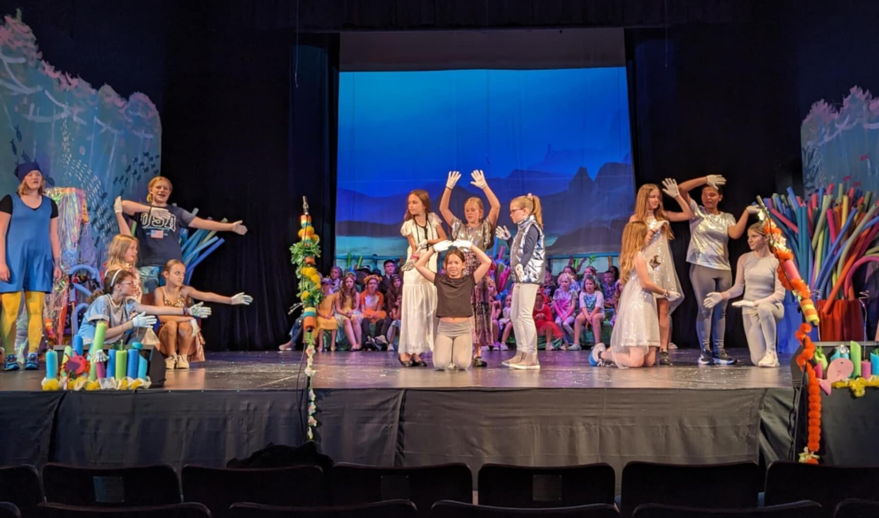 Fergus Fall Center for the Arts a Personally Endowed Fund Grant Recipient. Kids are performing a play on stage.