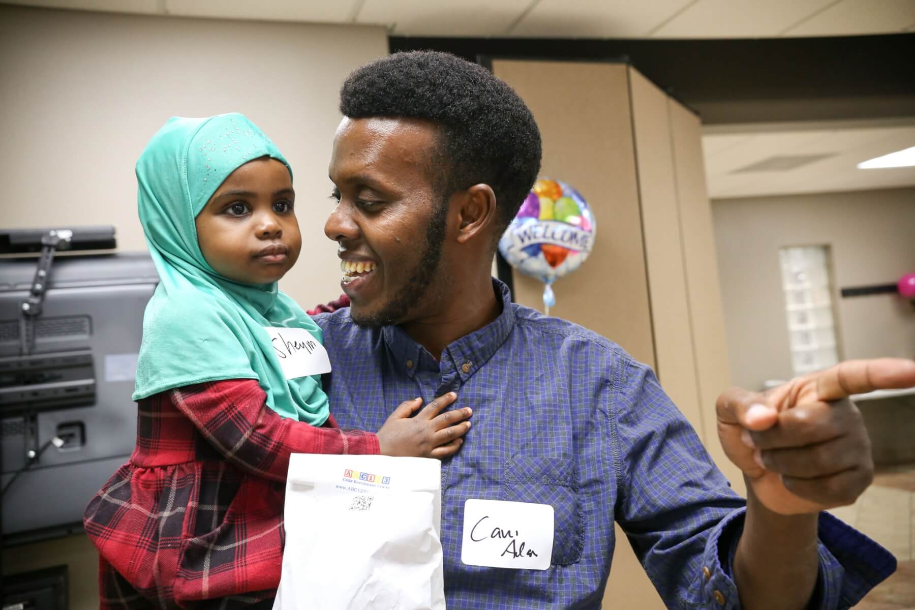 Dad holding child