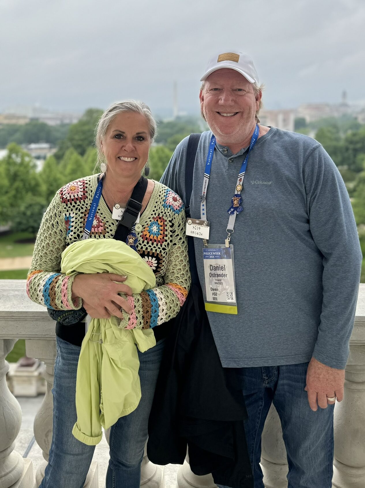 Dan and Barb Ostrander stand on a balcony.