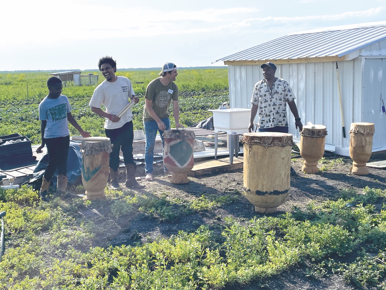 people performing outside with drums