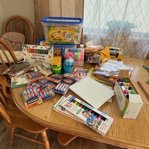 Supplies purchased with a grant from ECDF, including markers, crayons, glue, and other materials.